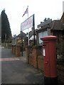 Postbox by the village hall at Churt