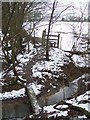TQ8331 : Footbridge and stile on High Weald Landscape Trail near Kemsdale House by David Anstiss