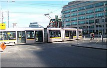 O1634 : A LUAS tram crosses Amiens Street from the direction of Store Street by Eric Jones