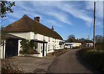 SX7796 : Thatched cottages, Woodland Head by Derek Harper