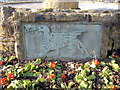 Dragon plaque on  a dry fountain