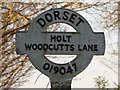 Holt: detail of Woodcutts Lane signpost