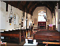 TF6712 : The church of St Michael and All Angels and Holy Cross - view east by Evelyn Simak