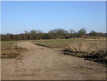 SP2251 : Stratford Airfield perimeter road by David P Howard