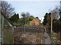 On a public footpath through allotment gardens