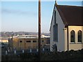 View past the facade of St Mary of the Assumption towards the Quays Shopping Centre