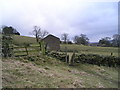 Stile and barn