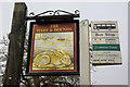 Pub sign and bus stop, Godstone