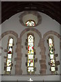 Stained glass window above the altar at Holy Cross, Bignor