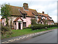 Pink cottages by the village green in Rushall