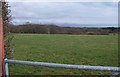 Pasture land crossed by power lines south of Penbryn