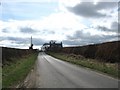 Minor road heading for cottages at Roxburgh Barns