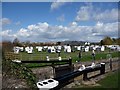 A busy canal-side caravan site