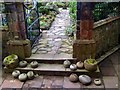 Curling stones at the entrance to the back garden at Broughton House