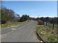 Minor road heading across the A74(M) motorway