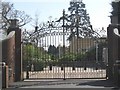 Gates of Tittenhurst Park with security bollards beyond