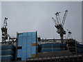 Cranes looming above Mitre Square