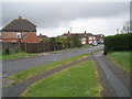 Looking along Loose Lane towards Peveril Close