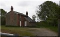 Woolmer Pond Cottage from the gateway