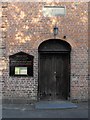 Llanllwchaiarn Parish Church - west door