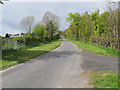 Minor road heading past Hutton Hall Barns