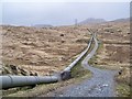 NN2721 : HEP Water Pipeline In Rugged Moorland by James T M Towill