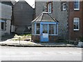 Disused petrol pump kiosk at C. Dean and Son