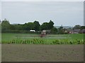 Crop spraying in fields near Winstanley College