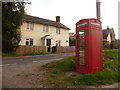 Woodcutts: phone box and house