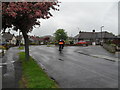 Cyclist turning from Greentrees Crescent into Garden Close