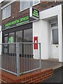 Postbox outside atakeaway in Manor Road