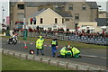 Paramedics attend to a fallen rider at the NorthWest 200