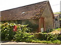 Batcombe: postbox and barn