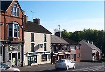 J3436 : Shops at the top of Mill Hill, Castlewellan by Eric Jones
