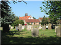 TF7319 : View across the churchyard in Gayton by Evelyn Simak