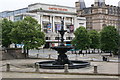 A fountain and The Empire Theatre