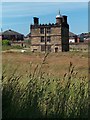 Sheffield Manor - The Turret House with local authority housing behind