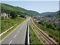 Road and rail viewed from Cwm footbridge