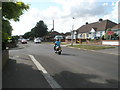 Scooter passing the junction of Seafield Road and Orchard Grove