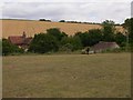 The Pest House at Findon seen across a field