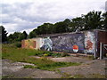 Mural behind the garages at Clover Gardens