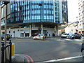 Tricycle passing the Park Plaza at the rear of Waterloo Station