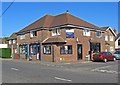 Three shops on the corner of High Street and Oak Lane