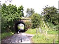 Farm track passes under  railway bridge at Hall