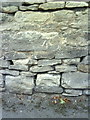 Benchmark on wall at junction of Bevington Road and Woodstock Road