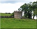 Small round tower, possibly a water tank.