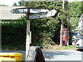 Village signpost with phone box, Draethen