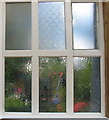 Hammered (cathedral) glass window at the Voysey Studio