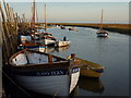TG0244 : Boats, early morning, Blakeney by Peter Barr