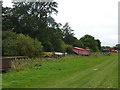 Farm equipment, bridleway and copse